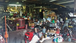 Small cluttered garage photo at Skurka Estate auction Sparta Michigan 2014