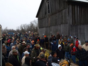 Scene from Potter estate sales auction with people buying snowmobiles